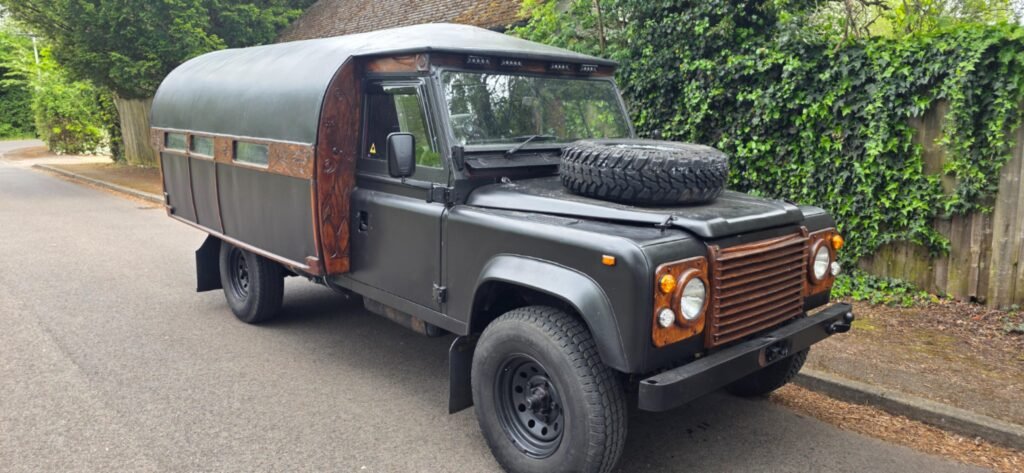 This Pictures shows a classic Land Rover converted to a camper.